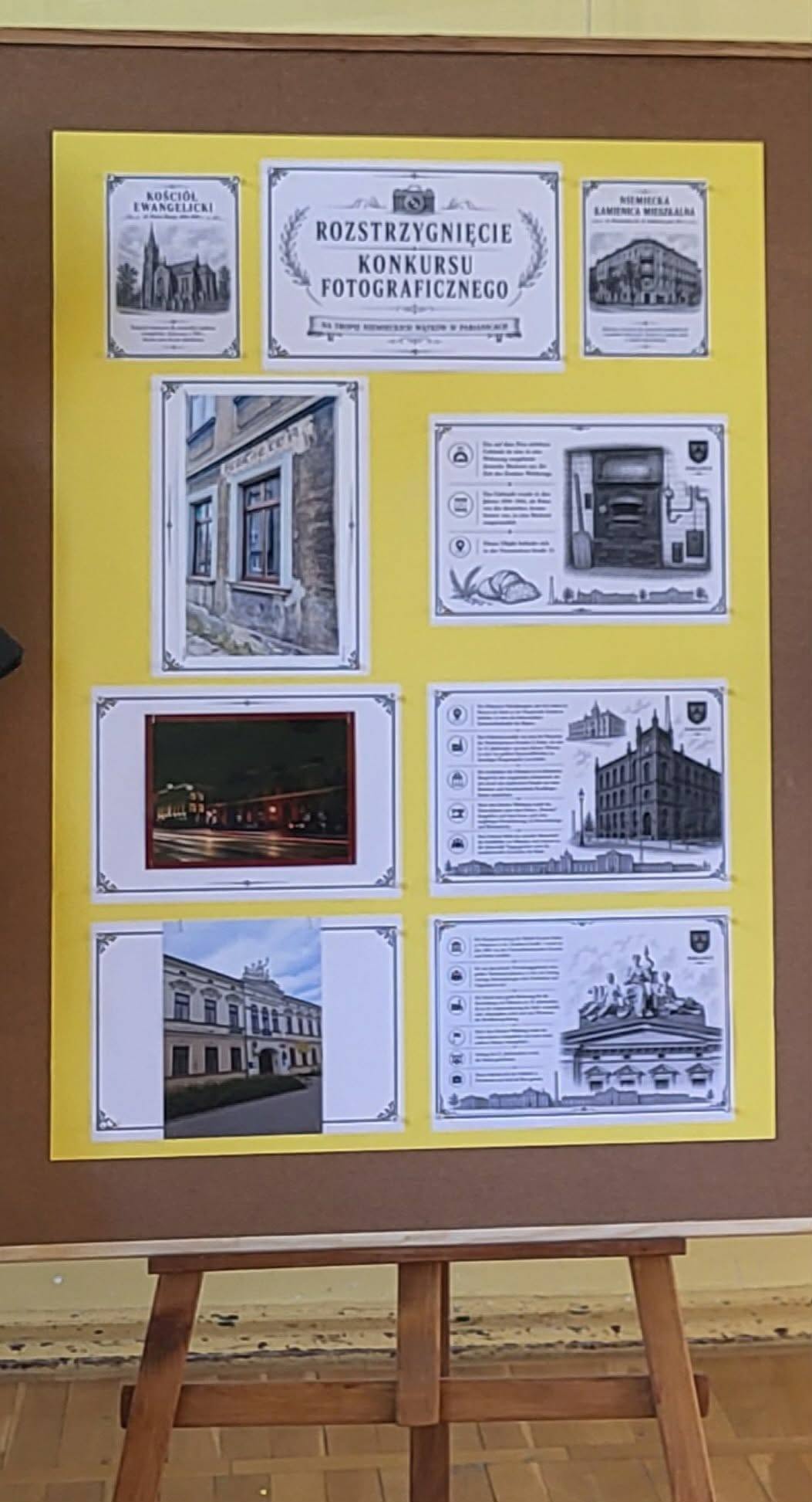 Wystawa nagrodzonych prac konkursowych przedstawiających niemieckie wątki historyczne i architektoniczne w Pabianicach wraz z opisami w języku niemieckim.